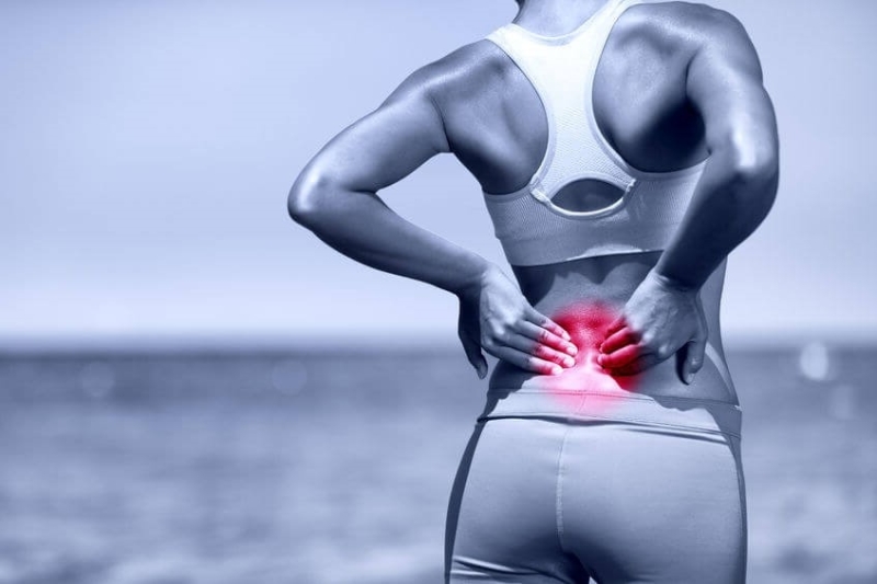 athletic-running-woman-with-back-pain.jpg